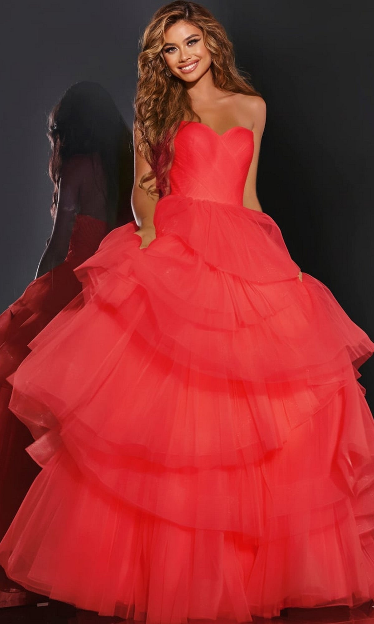 Jovani 40394 strapless red ball gown with a sweetheart neckline and a full, multi-layered ruffled skirt.
